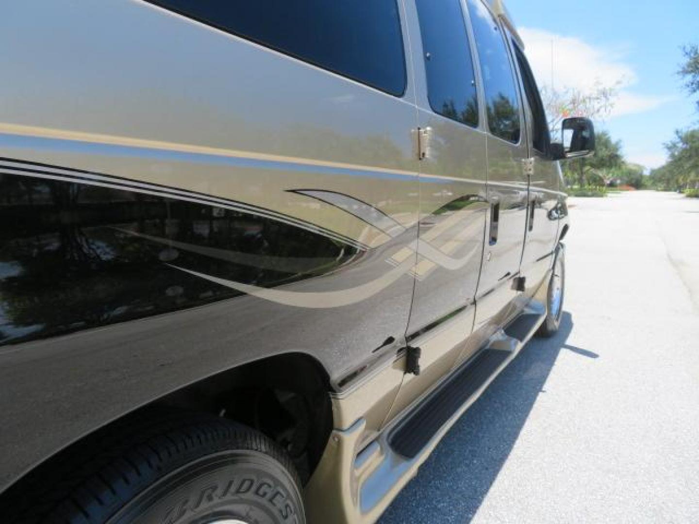 2010 Gold Ford Econoline Wagon E-150 (1FTNE1EL6AD) with an 5.4L V8 SOHC 16V engine, 4-Speed Automatic transmission, located at 4301 Oak Circle #19, Boca Raton, FL, 33431, (954) 561-2499, 26.388861, -80.084038 - You are looking at a Beautiful 2010 Ford Econoline Handicap Wheelchair Converison Van Tuscany VMI Conversion with 48K Original Miles, Ricon Side Entry Wheelchair Lift (the lift is almost brand new), 800lbs Capacity Lift, Raised Side Entry Doors, L Track Ratchet Tie-Downs in the floor, Factory Naviga - Photo#35