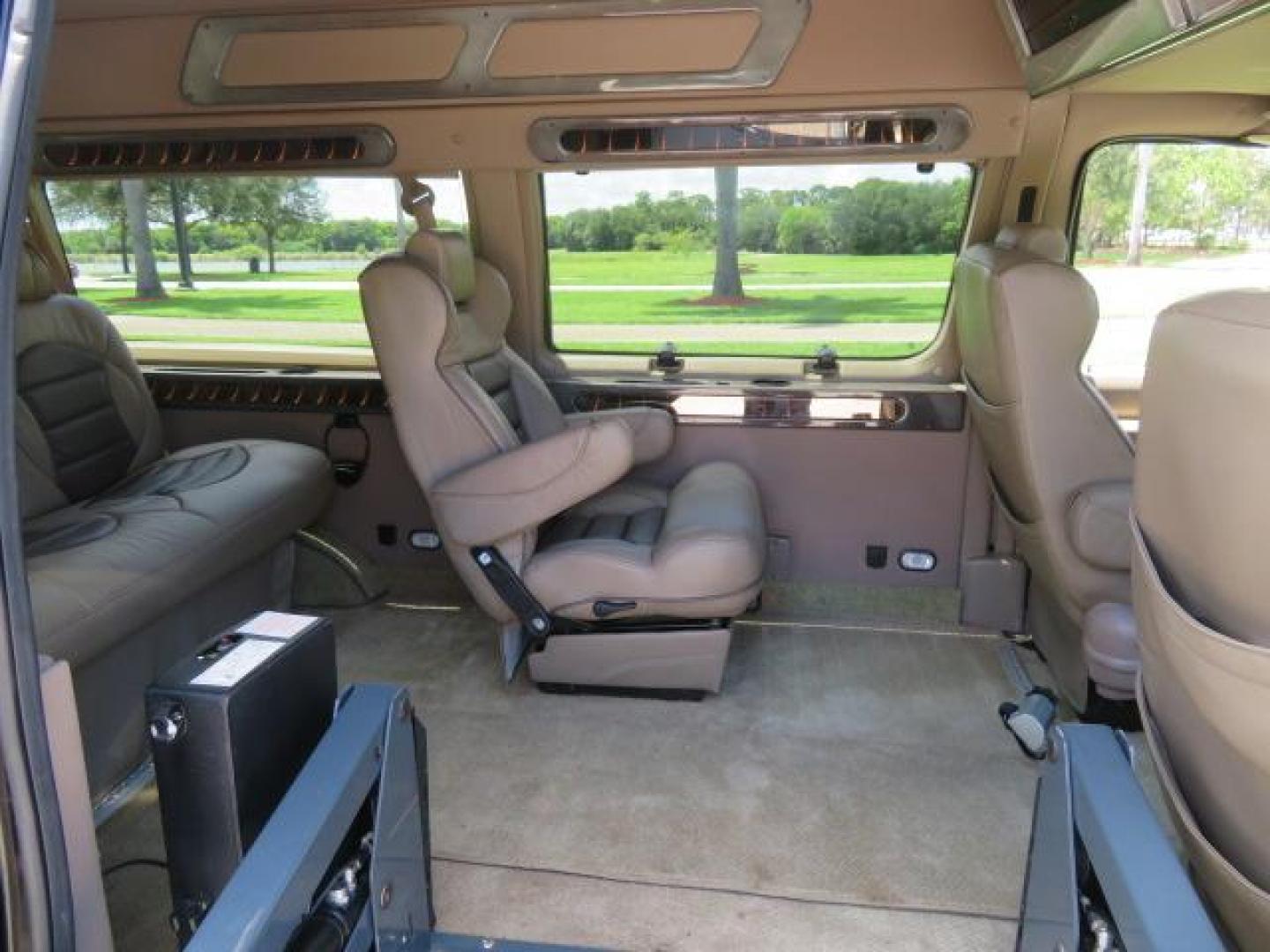 2010 Gold Ford Econoline Wagon E-150 (1FTNE1EL6AD) with an 5.4L V8 SOHC 16V engine, 4-Speed Automatic transmission, located at 4301 Oak Circle #19, Boca Raton, FL, 33431, (954) 561-2499, 26.388861, -80.084038 - You are looking at a Beautiful 2010 Ford Econoline Handicap Wheelchair Converison Van Tuscany VMI Conversion with 48K Original Miles, Ricon Side Entry Wheelchair Lift (the lift is almost brand new), 800lbs Capacity Lift, Raised Side Entry Doors, L Track Ratchet Tie-Downs in the floor, Factory Naviga - Photo#54