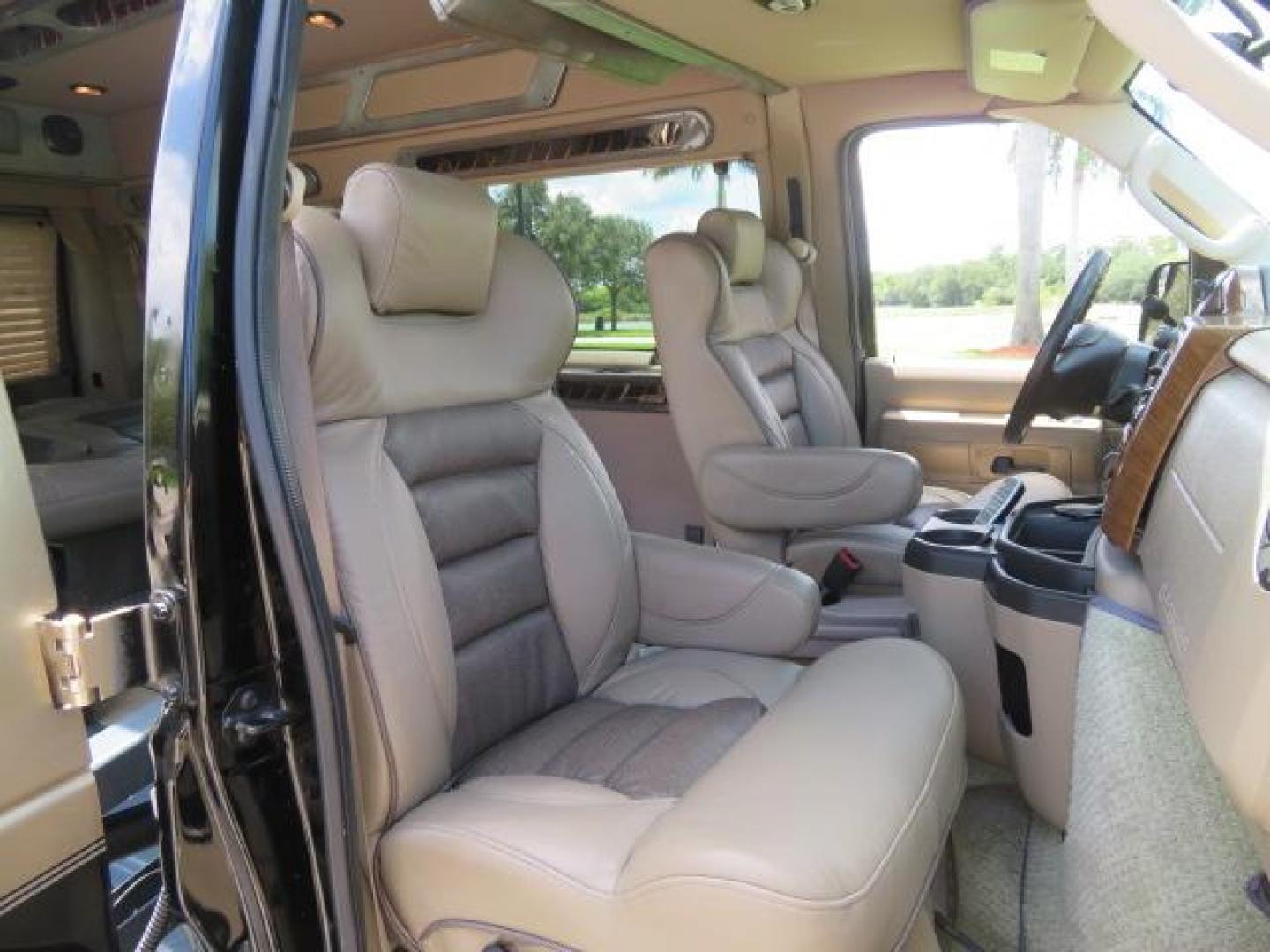 2010 Gold Ford Econoline Wagon E-150 (1FTNE1EL6AD) with an 5.4L V8 SOHC 16V engine, 4-Speed Automatic transmission, located at 4301 Oak Circle #19, Boca Raton, FL, 33431, (954) 561-2499, 26.388861, -80.084038 - You are looking at a Beautiful 2010 Ford Econoline Handicap Wheelchair Converison Van Tuscany VMI Conversion with 48K Original Miles, Ricon Side Entry Wheelchair Lift (the lift is almost brand new), 800lbs Capacity Lift, Raised Side Entry Doors, L Track Ratchet Tie-Downs in the floor, Factory Naviga - Photo#72