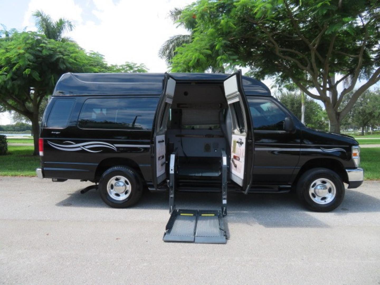 2014 Black Ford E-Series Van E-250 Extended (1FTNS2ELXED) with an 5.4L V8 SOHC 16V FFV engine, 4-Speed Automatic transmission, located at 4301 Oak Circle #19, Boca Raton, FL, 33431, (954) 561-2499, 26.388861, -80.084038 - You are looking at a Gorgeous Black 2014 Ford Econoline E250 Extended Handicap Wheelchair Conversion Van with 21K Original Miles and Fully Loaded with all the options including: Avenger Conversion Package, Ricon Slide Away 600LB Side Entry Wheelchair Lift, Lowered Floor, Expanded Side Entry Doors, P - Photo#0