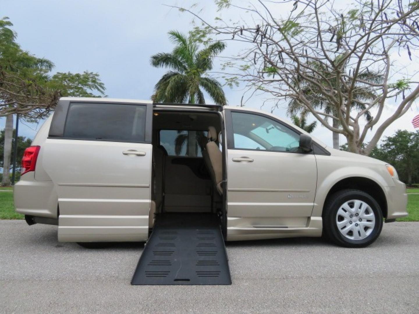 2013 Gold /Tan Dodge Grand Caravan SE (2C4RDGBG8DR) with an 3.6L V6 DOHC 24V engine, 6-Speed Automatic transmission, located at 4301 Oak Circle #19, Boca Raton, FL, 33431, (954) 561-2499, 26.388861, -80.084038 - You are looking at a Gorgeous 2015 Dodge Grand Caravan Braunability Handicap Wheelchair Side Entry, Conversion Van with 18K Original Miles, Lowered Floor, Kneelvan, EZ Lock Passenger Side, Q Straint Ratchet Tie Down System, Quick Release Front Seats, and Much Much More. This is a Beautiful Florida V - Photo#0