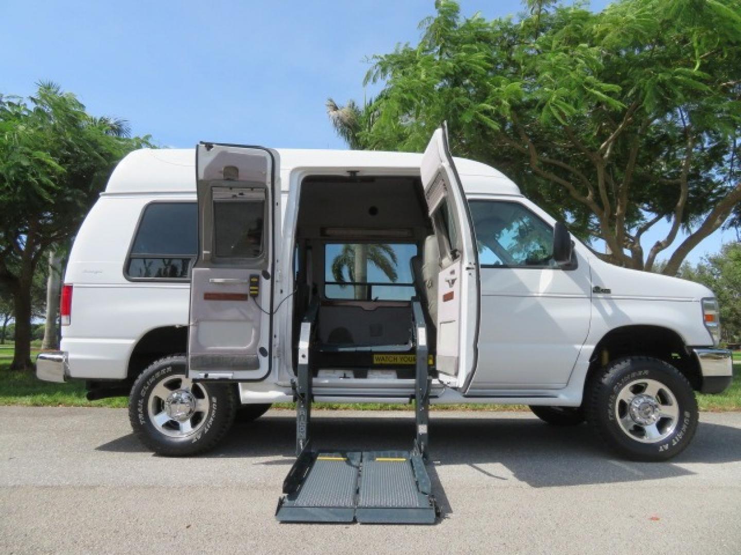 2010 White Ford E-Series Van E-350 Super Duty (1FTSE3ESXAD) with an 6.8L V10 SOHC 20V engine, located at 4301 Oak Circle #19, Boca Raton, FL, 33431, (954) 561-2499, 26.388861, -80.084038 - You are looking at a Beautiful and Extremely Rare 2010 Ford Econoline E350 Super Duty High Top Quigley 4x4 Handicap Wheelchair Conversion Van. This is a very nice Rust Free and Smoke Free Conversion Van with a Clean Carfax and Clean Title. No Stories and No Issues. This van is fully loaded with all - Photo#0