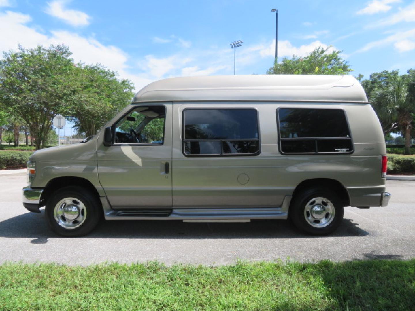 2013 Gold /Beige Ford E-Series Van E-150 (1FDNE1EL2DD) with an 5.4L V8 SOHC 16V FFV engine, 4-Speed Automatic transmission, located at 4301 Oak Circle #19, Boca Raton, FL, 33431, (954) 561-2499, 26.388861, -80.084038 - You are looking at a Gorgeous 2013 Ford Econoline E150 High Top Handicap Wheelchair Conversion Van with 43K Original Miles, Remote Powered Braun UVL Side Entry Wheelchair Lift, Power Side Entry Doors, Expanded Side Entry Doors, Hard Rubber Wheelchair Flooring in the rear of the vehicle, EZ Lock in t - Photo#11