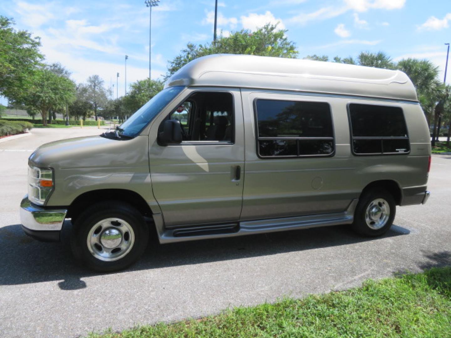 2013 Gold /Beige Ford E-Series Van E-150 (1FDNE1EL2DD) with an 5.4L V8 SOHC 16V FFV engine, 4-Speed Automatic transmission, located at 4301 Oak Circle #19, Boca Raton, FL, 33431, (954) 561-2499, 26.388861, -80.084038 - You are looking at a Gorgeous 2013 Ford Econoline E150 High Top Handicap Wheelchair Conversion Van with 43K Original Miles, Remote Powered Braun UVL Side Entry Wheelchair Lift, Power Side Entry Doors, Expanded Side Entry Doors, Hard Rubber Wheelchair Flooring in the rear of the vehicle, EZ Lock in t - Photo#22