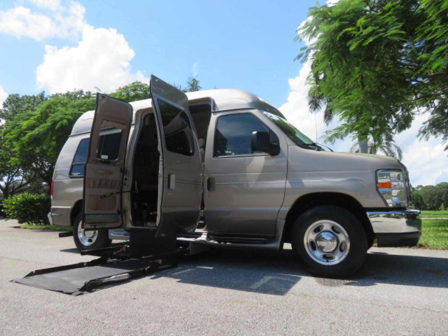 2013 Gold /Beige Ford E-Series Van E-150 (1FDNE1EL2DD) with an 5.4L V8 SOHC 16V FFV engine, 4-Speed Automatic transmission, located at 4301 Oak Circle #19, Boca Raton, FL, 33431, (954) 561-2499, 26.388861, -80.084038 - You are looking at a Gorgeous 2013 Ford Econoline E150 High Top Handicap Wheelchair Conversion Van with 43K Original Miles, Remote Powered Braun UVL Side Entry Wheelchair Lift, Power Side Entry Doors, Expanded Side Entry Doors, Hard Rubber Wheelchair Flooring in the rear of the vehicle, EZ Lock in t - Photo#0