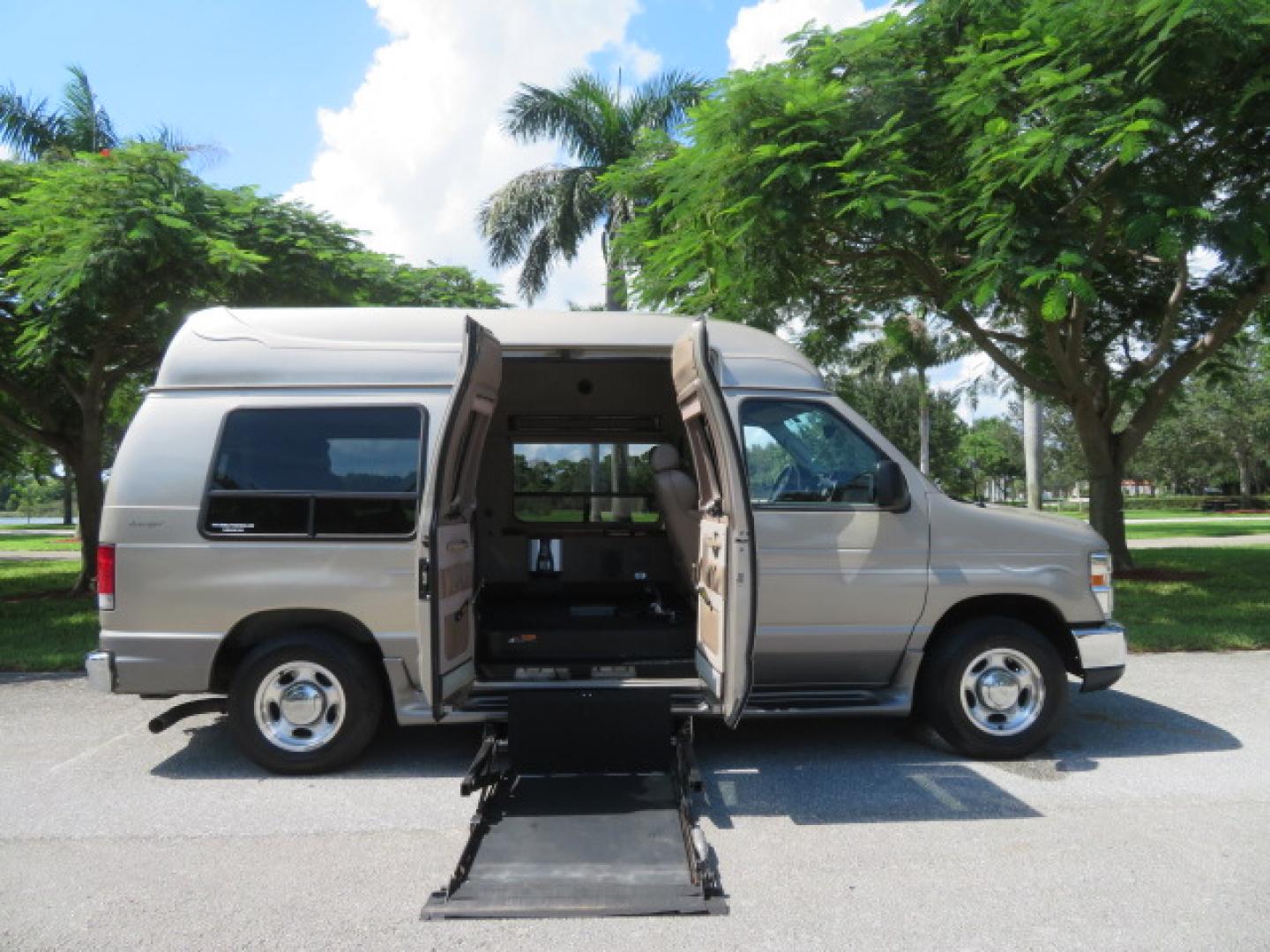 2013 Gold /Beige Ford E-Series Van E-150 (1FDNE1EL2DD) with an 5.4L V8 SOHC 16V FFV engine, 4-Speed Automatic transmission, located at 4301 Oak Circle #19, Boca Raton, FL, 33431, (954) 561-2499, 26.388861, -80.084038 - You are looking at a Gorgeous 2013 Ford Econoline E150 High Top Handicap Wheelchair Conversion Van with 43K Original Miles, Remote Powered Braun UVL Side Entry Wheelchair Lift, Power Side Entry Doors, Expanded Side Entry Doors, Hard Rubber Wheelchair Flooring in the rear of the vehicle, EZ Lock in t - Photo#1