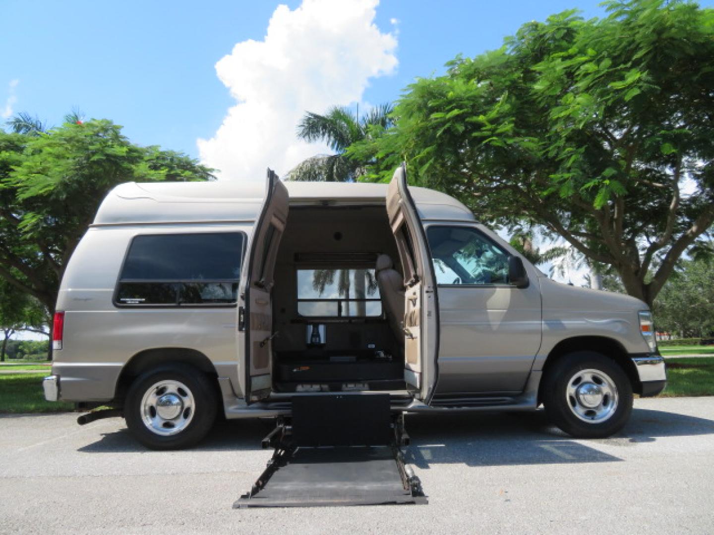 2013 Gold /Beige Ford E-Series Van E-150 (1FDNE1EL2DD) with an 5.4L V8 SOHC 16V FFV engine, 4-Speed Automatic transmission, located at 4301 Oak Circle #19, Boca Raton, FL, 33431, (954) 561-2499, 26.388861, -80.084038 - You are looking at a Gorgeous 2013 Ford Econoline E150 High Top Handicap Wheelchair Conversion Van with 43K Original Miles, Remote Powered Braun UVL Side Entry Wheelchair Lift, Power Side Entry Doors, Expanded Side Entry Doors, Hard Rubber Wheelchair Flooring in the rear of the vehicle, EZ Lock in t - Photo#44