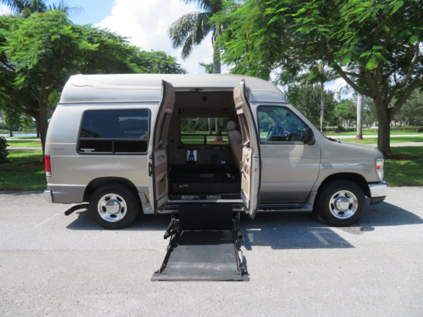 2013 Gold /Beige Ford E-Series Van E-150 (1FDNE1EL2DD) with an 5.4L V8 SOHC 16V FFV engine, 4-Speed Automatic transmission, located at 4301 Oak Circle #19, Boca Raton, FL, 33431, (954) 561-2499, 26.388861, -80.084038 - You are looking at a Gorgeous 2013 Ford Econoline E150 High Top Handicap Wheelchair Conversion Van with 43K Original Miles, Remote Powered Braun UVL Side Entry Wheelchair Lift, Power Side Entry Doors, Expanded Side Entry Doors, Hard Rubber Wheelchair Flooring in the rear of the vehicle, EZ Lock in t - Photo#45