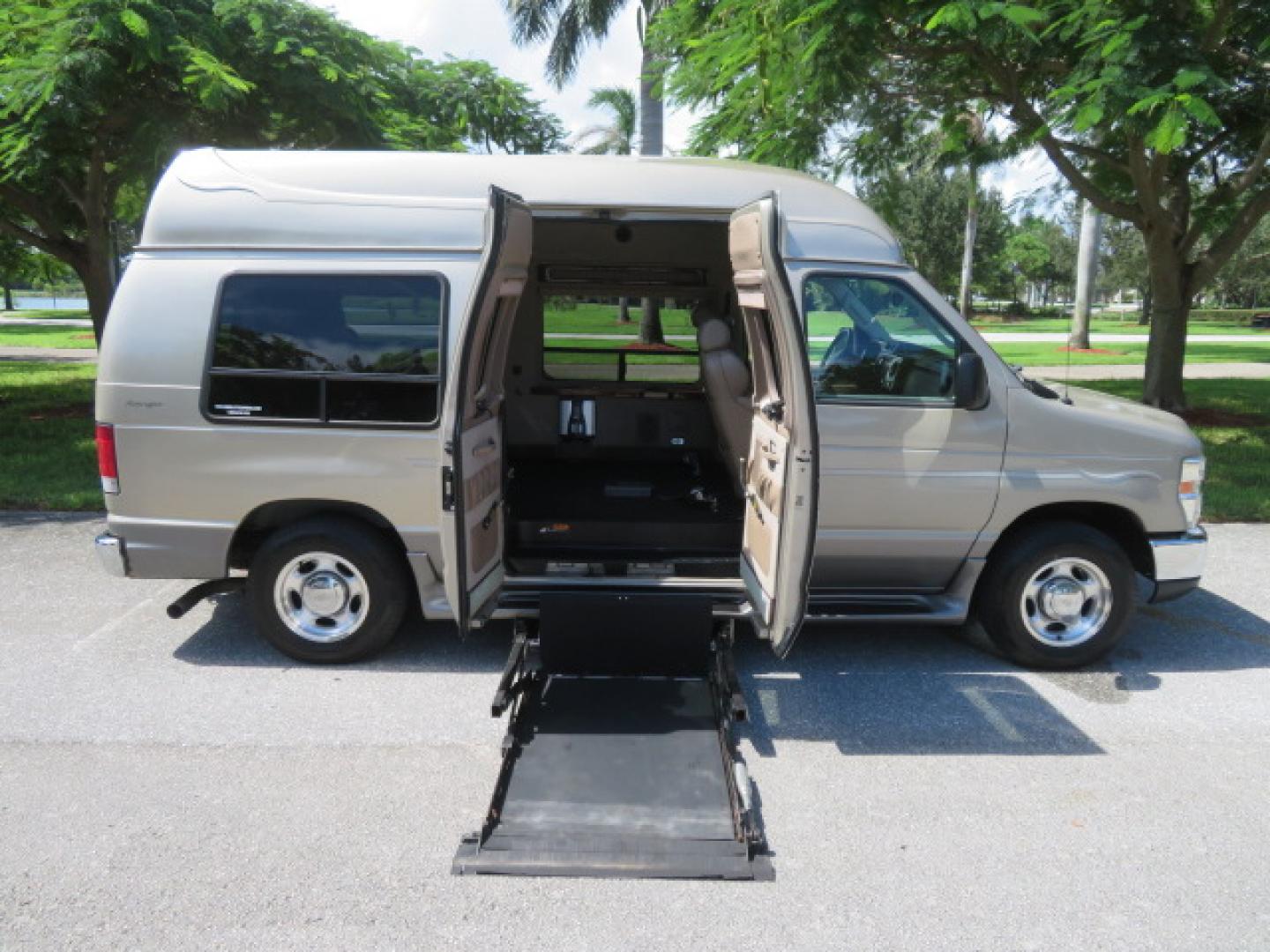 2013 Gold /Beige Ford E-Series Van E-150 (1FDNE1EL2DD) with an 5.4L V8 SOHC 16V FFV engine, 4-Speed Automatic transmission, located at 4301 Oak Circle #19, Boca Raton, FL, 33431, (954) 561-2499, 26.388861, -80.084038 - You are looking at a Gorgeous 2013 Ford Econoline E150 High Top Handicap Wheelchair Conversion Van with 43K Original Miles, Remote Powered Braun UVL Side Entry Wheelchair Lift, Power Side Entry Doors, Expanded Side Entry Doors, Hard Rubber Wheelchair Flooring in the rear of the vehicle, EZ Lock in t - Photo#49