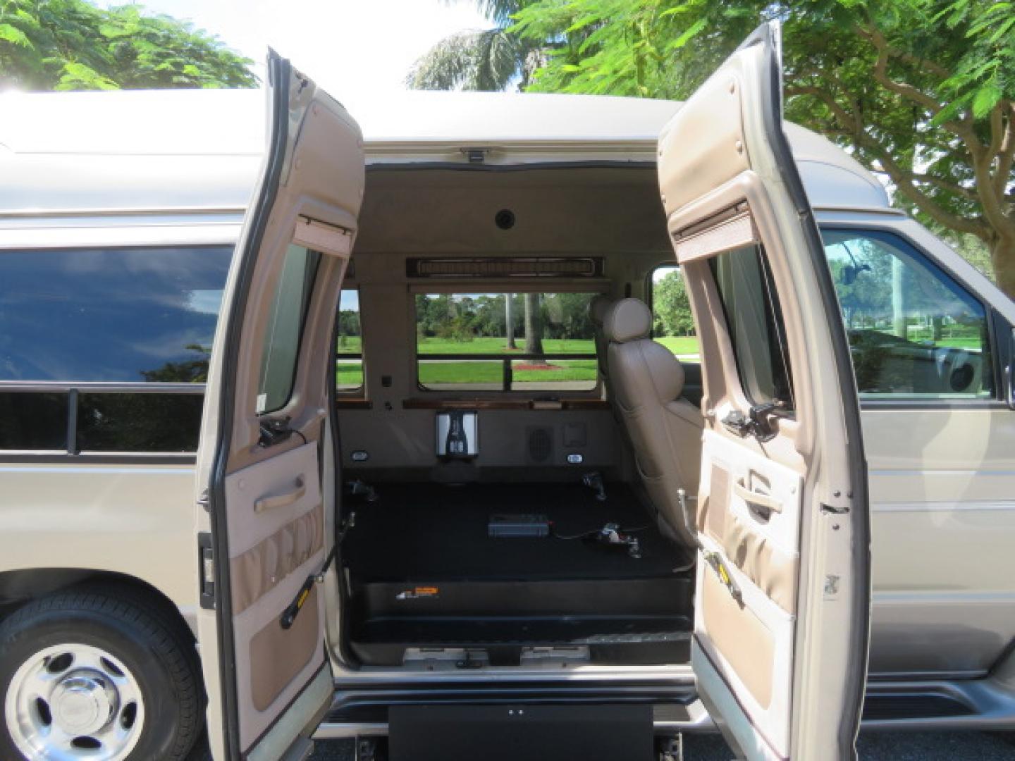 2013 Gold /Beige Ford E-Series Van E-150 (1FDNE1EL2DD) with an 5.4L V8 SOHC 16V FFV engine, 4-Speed Automatic transmission, located at 4301 Oak Circle #19, Boca Raton, FL, 33431, (954) 561-2499, 26.388861, -80.084038 - You are looking at a Gorgeous 2013 Ford Econoline E150 High Top Handicap Wheelchair Conversion Van with 43K Original Miles, Remote Powered Braun UVL Side Entry Wheelchair Lift, Power Side Entry Doors, Expanded Side Entry Doors, Hard Rubber Wheelchair Flooring in the rear of the vehicle, EZ Lock in t - Photo#50