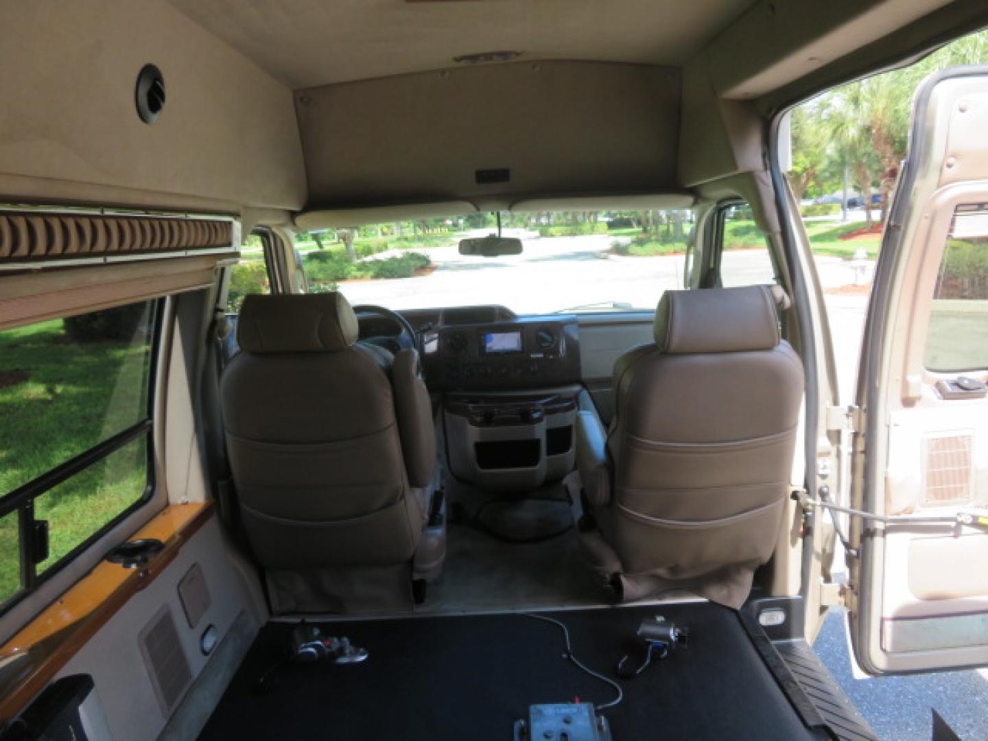 2013 Gold /Beige Ford E-Series Van E-150 (1FDNE1EL2DD) with an 5.4L V8 SOHC 16V FFV engine, 4-Speed Automatic transmission, located at 4301 Oak Circle #19, Boca Raton, FL, 33431, (954) 561-2499, 26.388861, -80.084038 - You are looking at a Gorgeous 2013 Ford Econoline E150 High Top Handicap Wheelchair Conversion Van with 43K Original Miles, Remote Powered Braun UVL Side Entry Wheelchair Lift, Power Side Entry Doors, Expanded Side Entry Doors, Hard Rubber Wheelchair Flooring in the rear of the vehicle, EZ Lock in t - Photo#57