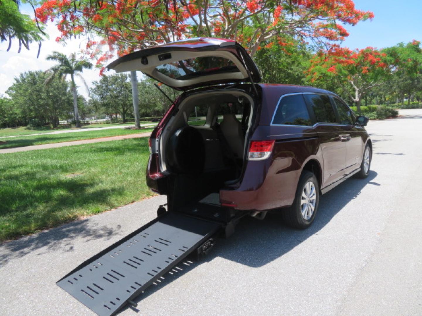 2016 Red /Beige Honda Odyssey EX-L (5FNRL5H62GB) with an 3.5L V6 SOHC 24V engine, 6A transmission, located at 4301 Oak Circle #19, Boca Raton, FL, 33431, (954) 561-2499, 26.388472, -80.084045 - 2016 Honda Odyssey EXL with Navigation with 29K Original Miles Braunability Handicap Wheelchair Conversion Van Rear Entry Conversion. Gorgeous Low Mileage Florida Van Fully Loaded With Every Option Including: Remote Keyless Entry, Push Button Start, Beautiful Beige Leather Interior, Tech Package, Na - Photo#3