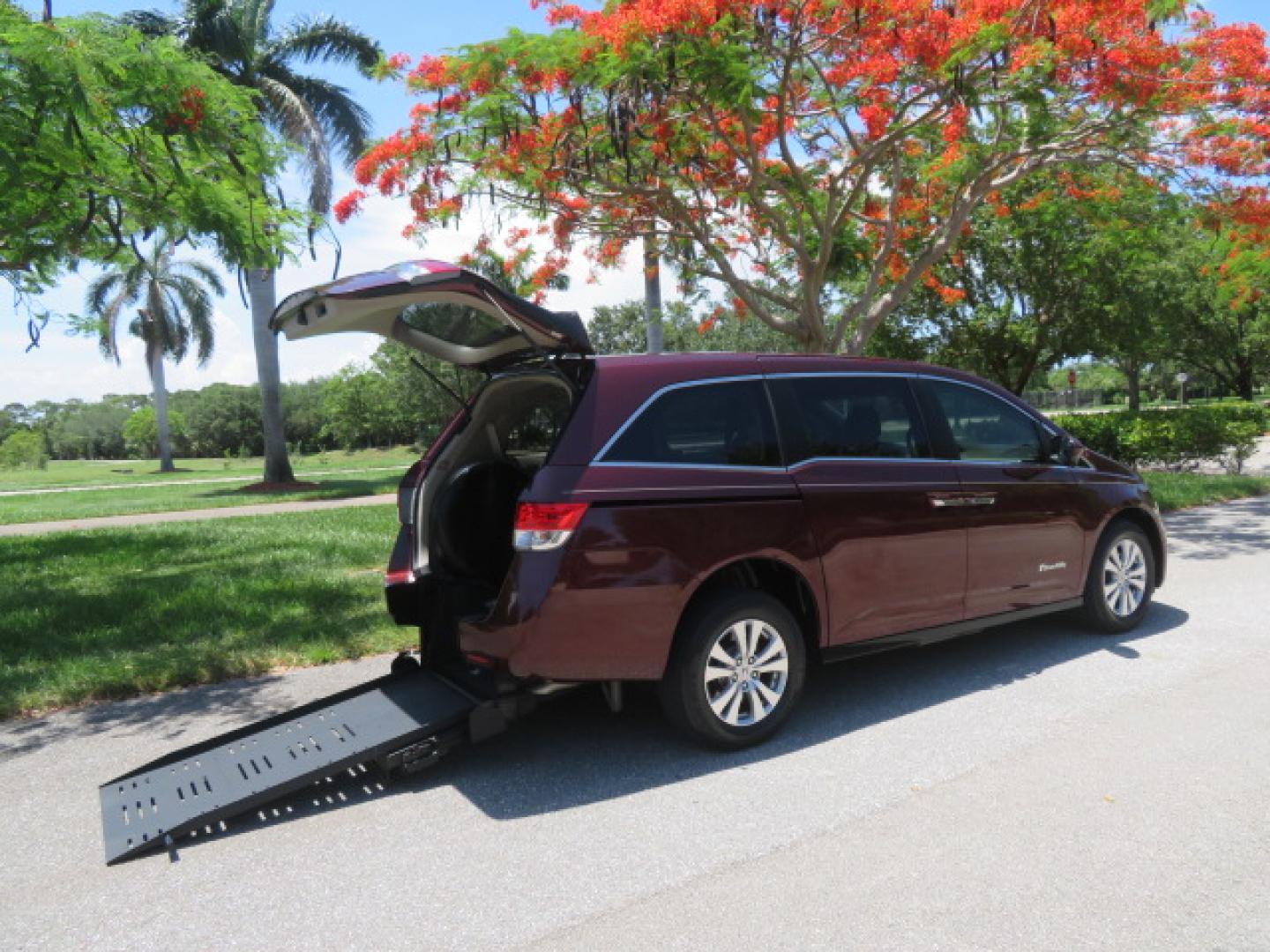2016 Red /Beige Honda Odyssey EX-L (5FNRL5H62GB) with an 3.5L V6 SOHC 24V engine, 6A transmission, located at 4301 Oak Circle #19, Boca Raton, FL, 33431, (954) 561-2499, 26.388472, -80.084045 - 2016 Honda Odyssey EXL with Navigation with 29K Original Miles Braunability Handicap Wheelchair Conversion Van Rear Entry Conversion. Gorgeous Low Mileage Florida Van Fully Loaded With Every Option Including: Remote Keyless Entry, Push Button Start, Beautiful Beige Leather Interior, Tech Package, Na - Photo#2