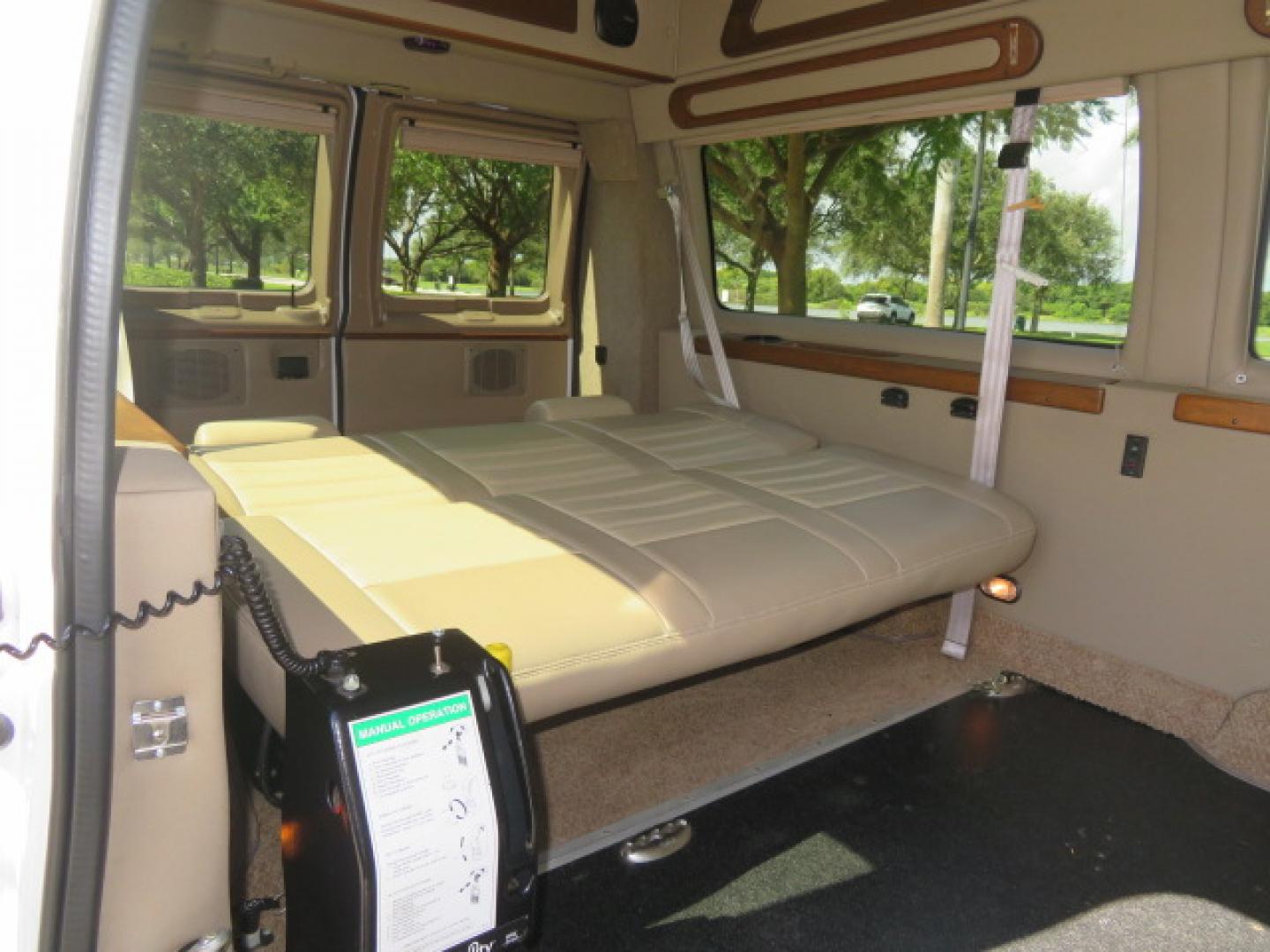 2014 White /Tan Ford E-Series Van E-150 (1FTNE1EL8ED) with an 5.4L V8 SOHC 16V FFV engine, 4-Speed Automatic transmission, located at 4301 Oak Circle #19, Boca Raton, FL, 33431, (954) 561-2499, 26.388472, -80.084045 - 2014 Ford E-Series Van E-150 Handicap Wheelchair Conversion Van 38K Original Miles Gorgeous Power Doors Transfer Seat Braun UVL - Photo#47
