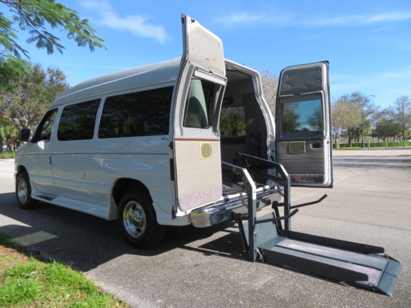 2013 White /Gray Ford E-Series Van E-150 (1FTNE1EL8DD) with an 5.4L V8 SOHC 16V FFV engine, 4-Speed Automatic transmission, located at 4301 Oak Circle #19, Boca Raton, FL, 33431, (954) 561-2499, 26.388472, -80.084045 - You are looking at a Gorgeous 2013 Ford Econoline High Top Rear Entry High Top Handicap Wheelchair Conversion van Tuscany VMI with 35K Original Miles, Ricon S Series 600LB Power Rear Entry Wheelchair Lift, , Q Straint Tie Downs Included, Room for 2 Wheelchairs, Hard Rubber Flooring, Window Shades, A - Photo#2