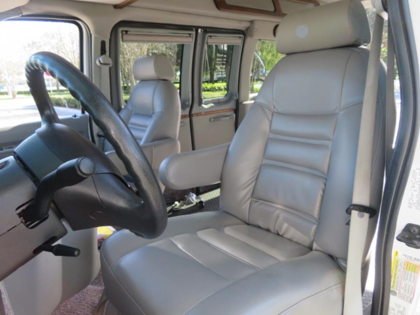 2013 White /Gray Ford E-Series Van E-150 (1FTNE1EL8DD) with an 5.4L V8 SOHC 16V FFV engine, 4-Speed Automatic transmission, located at 4301 Oak Circle #19, Boca Raton, FL, 33431, (954) 561-2499, 26.388472, -80.084045 - You are looking at a Gorgeous 2013 Ford Econoline High Top Rear Entry High Top Handicap Wheelchair Conversion van Tuscany VMI with 35K Original Miles, Ricon S Series 600LB Power Rear Entry Wheelchair Lift, , Q Straint Tie Downs Included, Room for 2 Wheelchairs, Hard Rubber Flooring, Window Shades, A - Photo#79