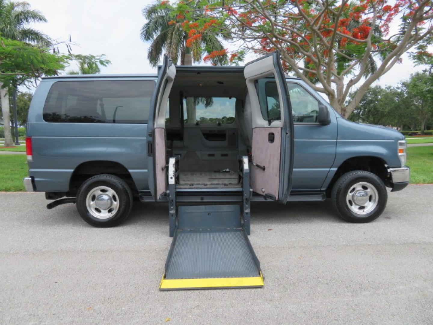 2014 Northsky Blue /Gray Ford E-Series Wagon E-150 XLT (1FMNE1BL1ED) with an 5.4L V8 SOHC 16V FFV engine, 4-Speed Automatic transmission, located at 4301 Oak Circle #19, Boca Raton, FL, 33431, (954) 561-2499, 26.388472, -80.084045 - You are looking at a Stunning 2014 Ford Econoline NorCal Max Handicap Wheelchair Conversion Van with 53K Original Miles, 9 Inch Fully Lowered Floor, Remote Control Power Side Entry Doors, Raised Side Entry Doors, Q Straint Tie Down System with Ratchet Straps, Quick Release Front Seats, VMI 600LB Sid - Photo#1