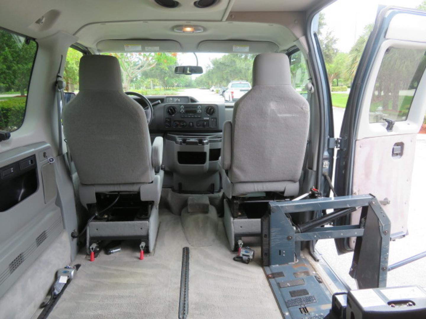 2014 Northsky Blue /Gray Ford E-Series Wagon E-150 XLT (1FMNE1BL1ED) with an 5.4L V8 SOHC 16V FFV engine, 4-Speed Automatic transmission, located at 4301 Oak Circle #19, Boca Raton, FL, 33431, (954) 561-2499, 26.388472, -80.084045 - You are looking at a Stunning 2014 Ford Econoline NorCal Max Handicap Wheelchair Conversion Van with 53K Original Miles, 9 Inch Fully Lowered Floor, Remote Control Power Side Entry Doors, Raised Side Entry Doors, Q Straint Tie Down System with Ratchet Straps, Quick Release Front Seats, VMI 600LB Sid - Photo#57