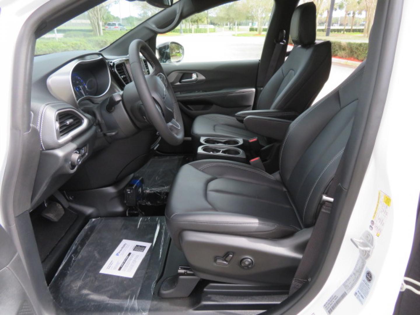 2025 White /Black Chrysler Pacifica Select (2C4RC1BG6SR) with an 3.6L V6 DOHC 24V engine, 9A transmission, located at 4301 Oak Circle #19, Boca Raton, FL, 33431, (954) 561-2499, 26.388472, -80.084045 - 2025 CHRYSLER PACIFICA SELECT Braunability Handicap Wheelchair Conversion with 280 Original Miles. Braun Power Foldout XT Ramp System. Clean Carfax No Stories. This van is Brand New. Still has original plastic from the facotry. Purchased new in November and the van was sold due to unfortunate circum - Photo#60