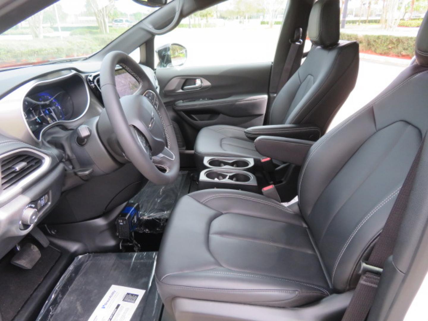 2025 White /Black Chrysler Pacifica Select (2C4RC1BG6SR) with an 3.6L V6 DOHC 24V engine, 9A transmission, located at 4301 Oak Circle #19, Boca Raton, FL, 33431, (954) 561-2499, 26.388472, -80.084045 - 2025 CHRYSLER PACIFICA SELECT Braunability Handicap Wheelchair Conversion with 280 Original Miles. Braun Power Foldout XT Ramp System. Clean Carfax No Stories. This van is Brand New. Still has original plastic from the facotry. Purchased new in November and the van was sold due to unfortunate circum - Photo#62