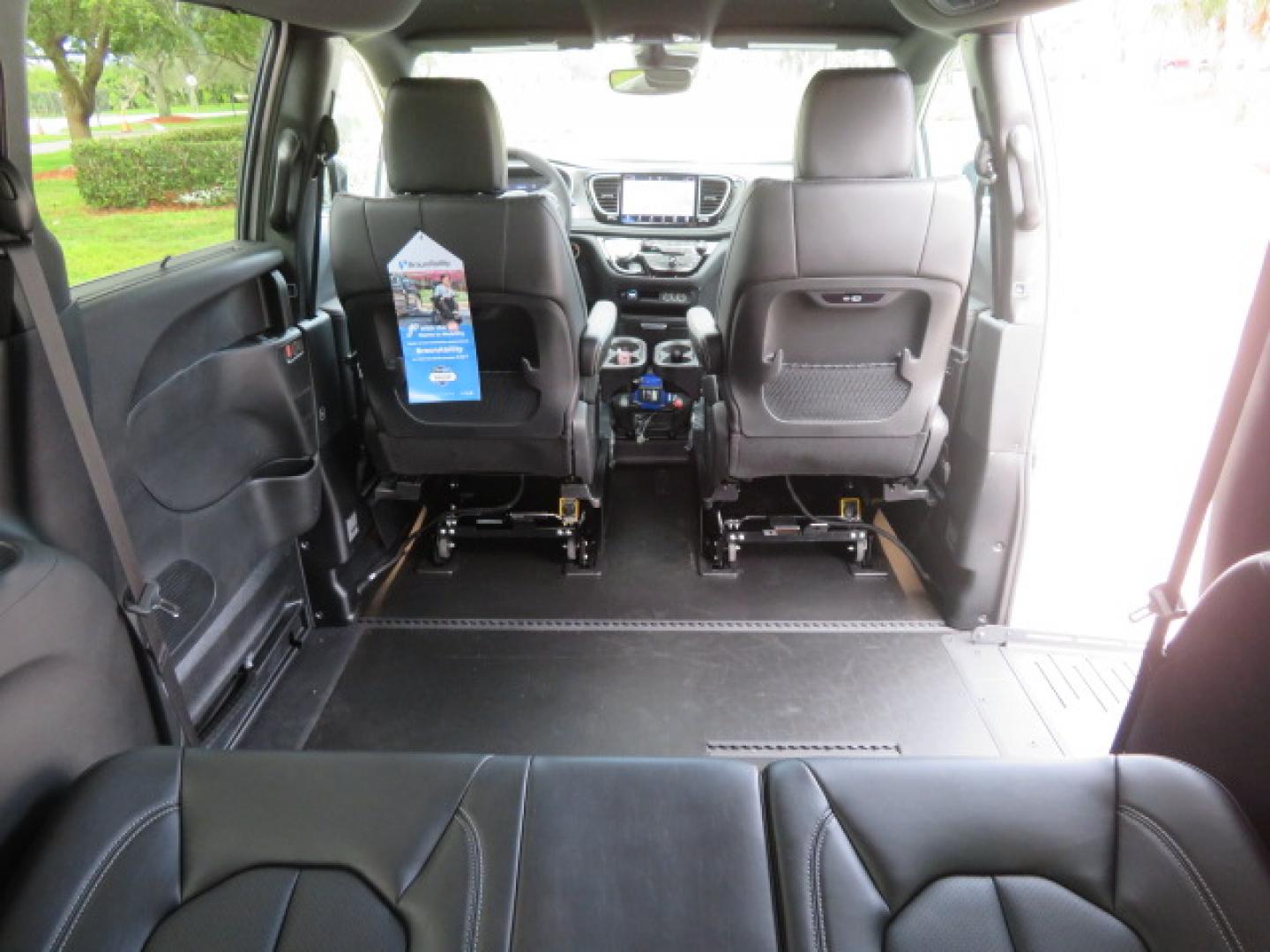 2025 White /Black Chrysler Pacifica Select (2C4RC1BG6SR) with an 3.6L V6 DOHC 24V engine, 9A transmission, located at 4301 Oak Circle #19, Boca Raton, FL, 33431, (954) 561-2499, 26.388472, -80.084045 - 2025 CHRYSLER PACIFICA SELECT Braunability Handicap Wheelchair Conversion with 280 Original Miles. Braun Power Foldout XT Ramp System. Clean Carfax No Stories. This van is Brand New. Still has original plastic from the facotry. Purchased new in November and the van was sold due to unfortunate circum - Photo#71